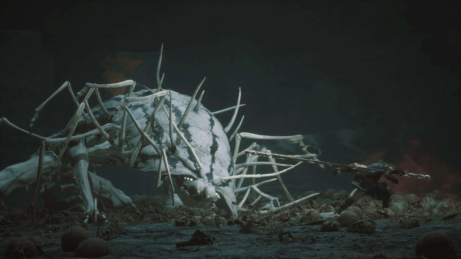 Black Myth: Wukong — in-game boss encounter screenshot against a giant centipede yaoguai in a skull-strewn cavern
