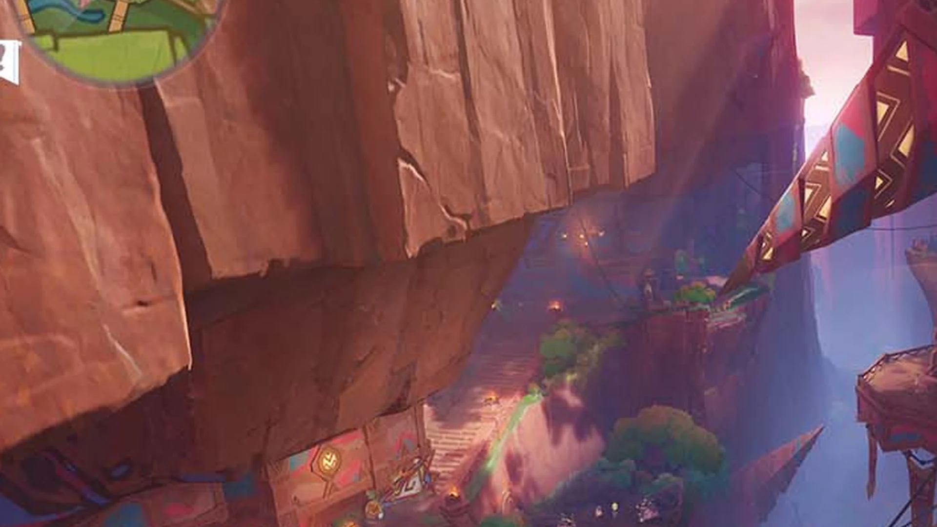 Genshin Impact — in-game screenshot: Natlan volcanic landscape with tribal structures and warm-toned cliffs at golden hour