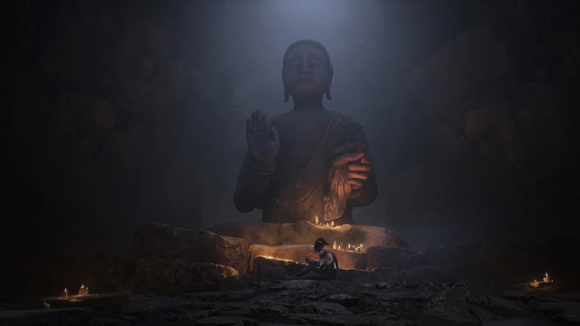 WUCHANG: Fallen Feathers — in-game cinematic still: Wuchang resting at the base of a giant stone Buddha in a candlelit cave