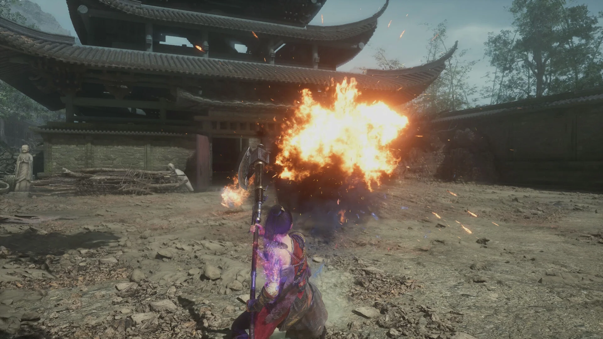 WUCHANG: Fallen Feathers — in-game combat screenshot: Wuchang unleashing a fire spell with purple feather energy around her shoulders in a temple courtyard